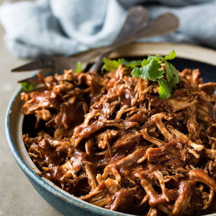 Mexican Shredded Chicken - The smokey, rich, mildly spicy sauce is incredible! Super easy, fast to prepare, for the slow cooker, pressure cooker or stovetop!