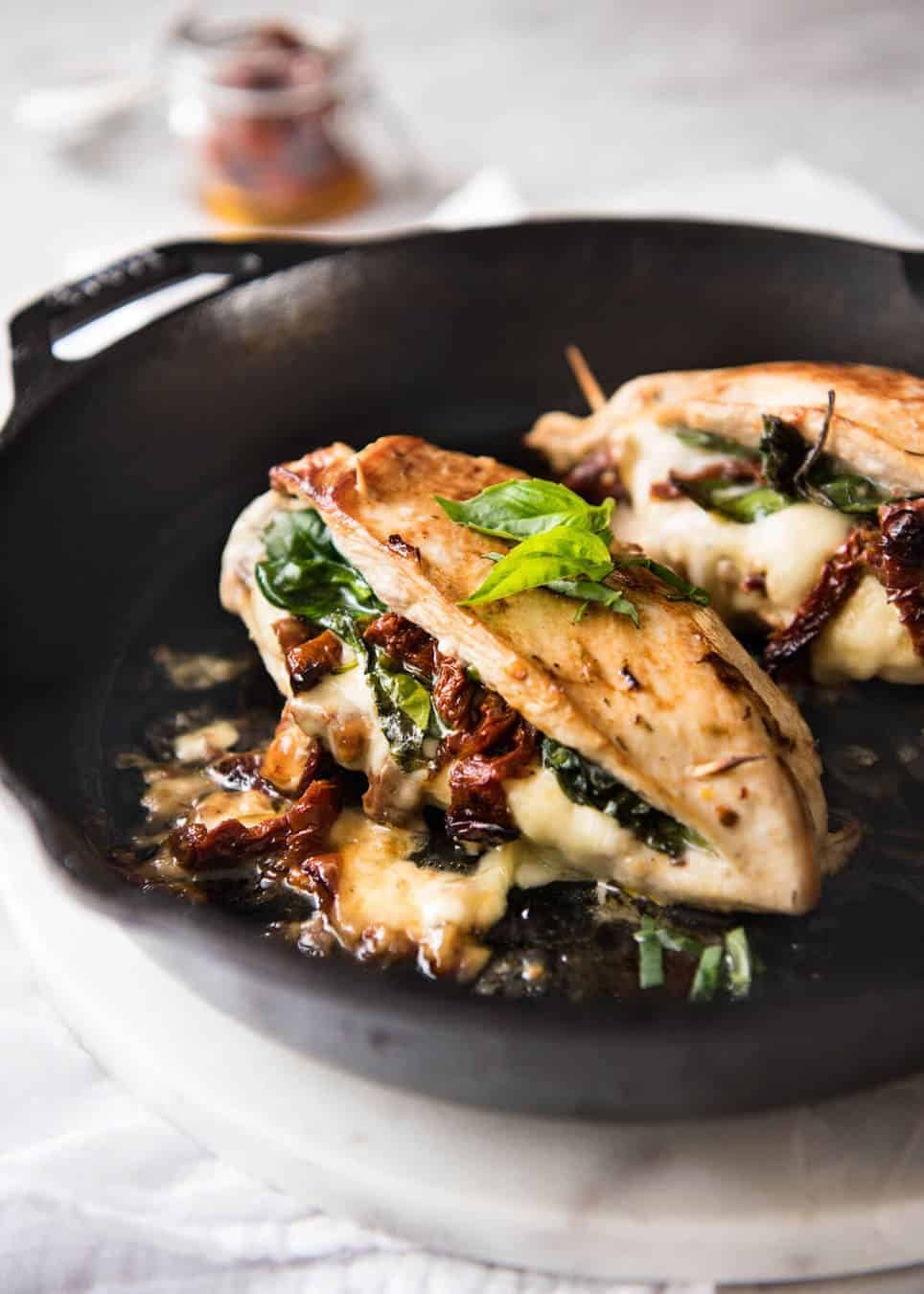 Baked Stuffed Chicken Breast - slathered in Italian flavours then stuffed with spinach, sun dried tomato and cheese. 5 minutes prep, no marinating required! recipetineats.com