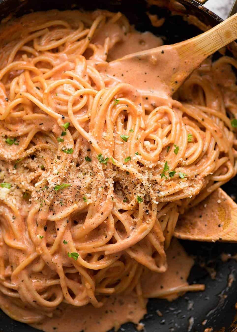 Creamy Tomato Pasta in a skillet with parmesan.