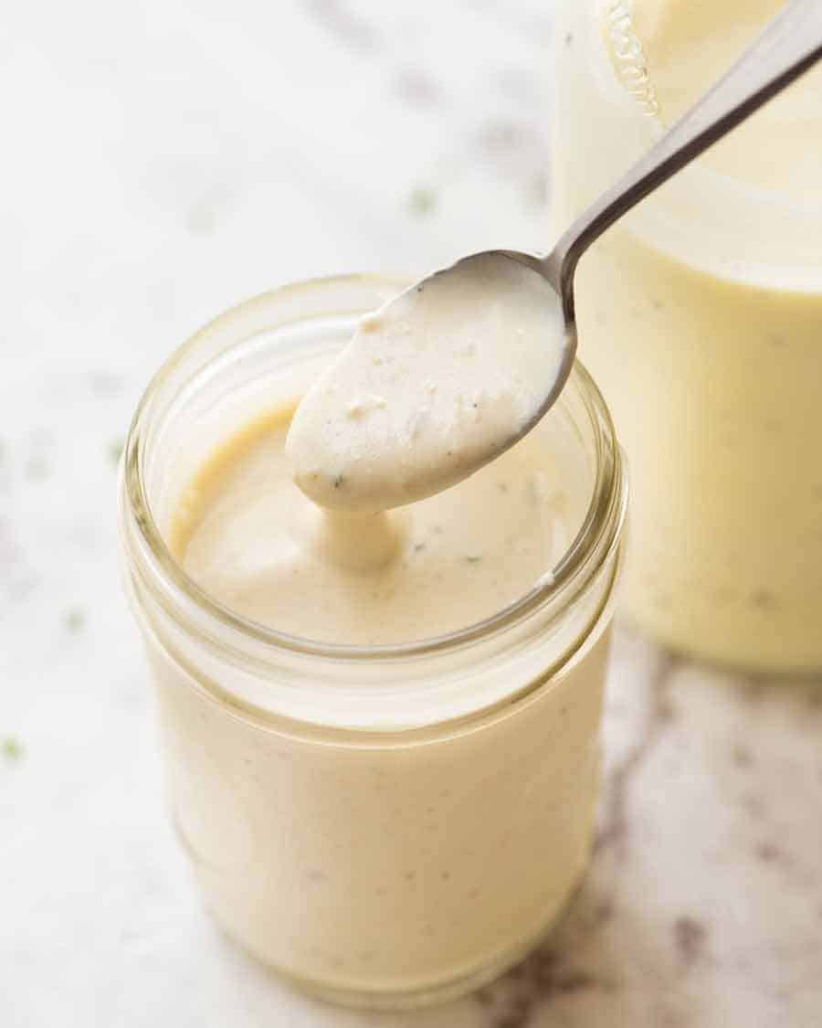 Close up of jar with Healthy Caesar salad Dressing (no mayo)