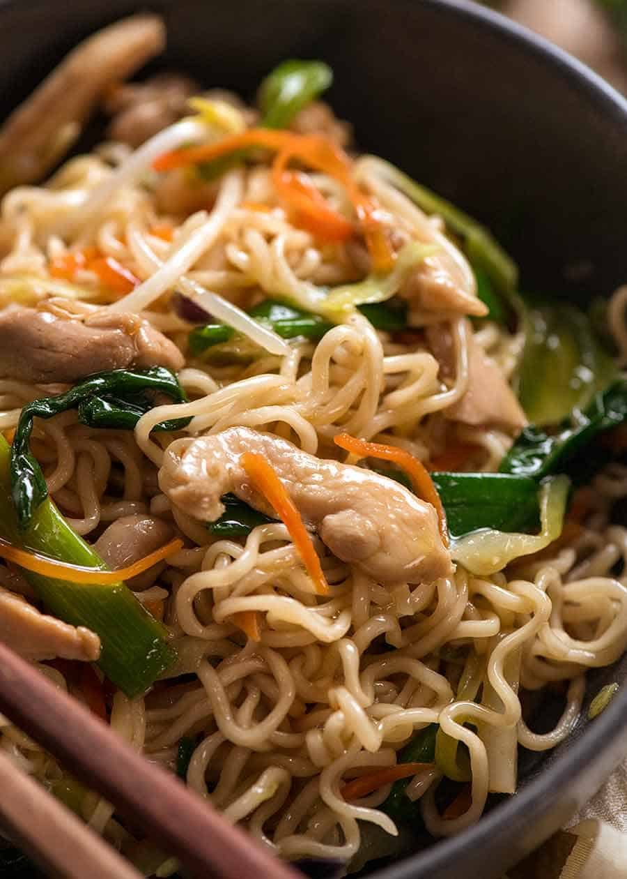 Close up of Chow Mein Ramen Noodles in a rustic black bowl, ready to be eaten 