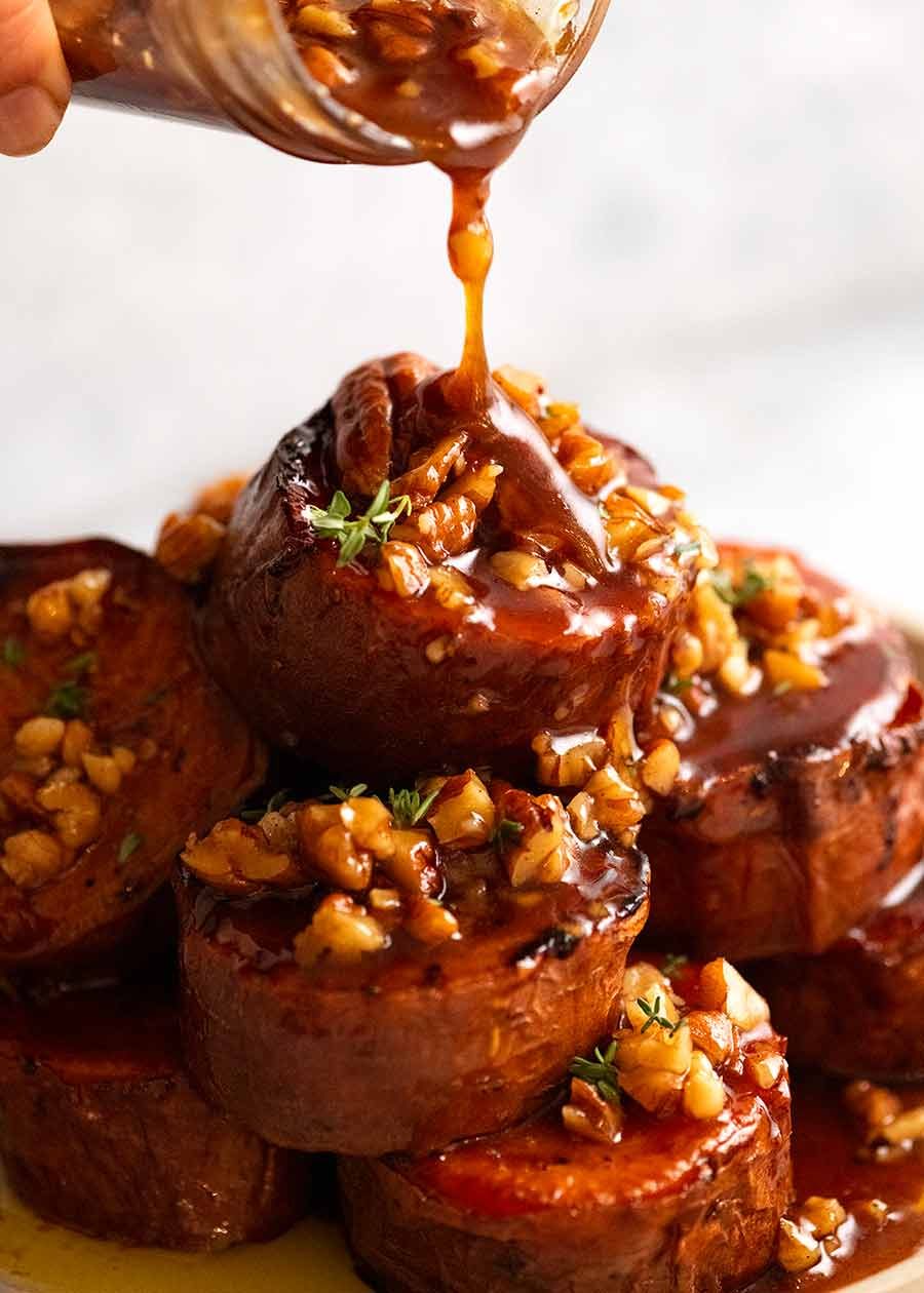 Pouring Maple Butter Sauce over Slow Roasted Fondant Sweet Potatoes